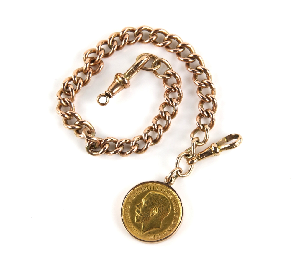 Albert chain, each curb link marked 9 ct, with two swivel clasps and 1927 full sovereign minted in