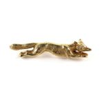 Fox brooch, set with a rose cut diamond eye, the fox is in a running position, in tested 9 ct,