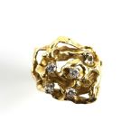 Vintage abstract diamond ring, set with four round brilliant cut diamonds, weighing an estimated