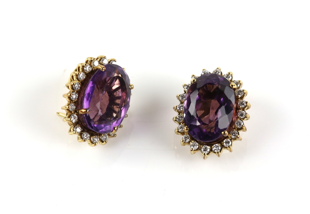 Pair of amethyst and diamond oval cluster earrings, featuring large oval faceted amethysts,