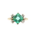 Emerald and diamond ring, square step cut emerald set at an angle to form a diamond, weighing an