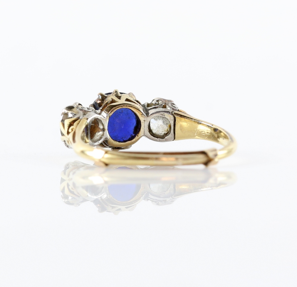 Sapphire and diamond three stone ring, centrally set with a round cut sapphire, estimated weight 1. - Image 3 of 3