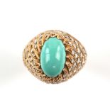 Turquoise and diamond bombé ring, central oval cabochon cut turquoise measuring approximately 12.5 x