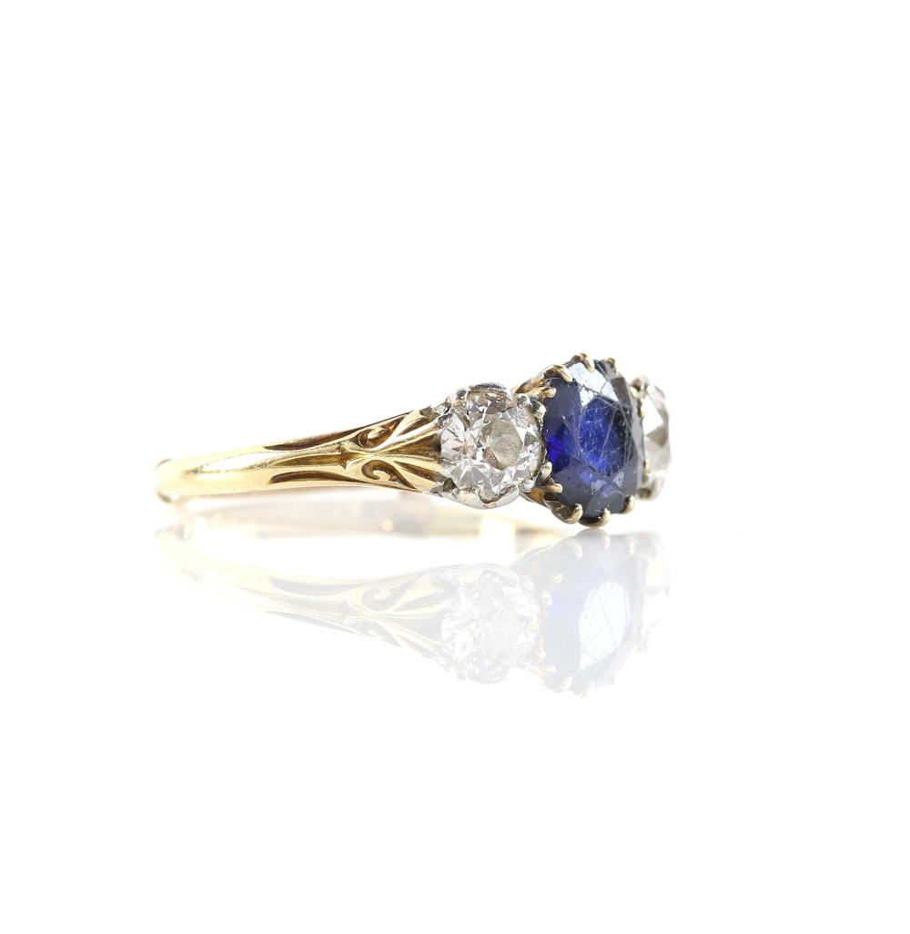 Sapphire and diamond three stone ring, centrally set with a round cut sapphire, estimated weight 1. - Image 2 of 3