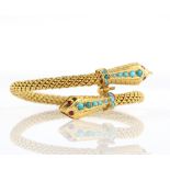 Double headed snake bangle, the textured heads set with round cabochon cut turquoise and round cut