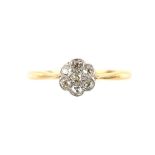 Edwardian flower cluster ring, set with seven old cut diamonds, estimated total weight 0.25