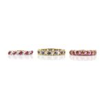 Three eternity rings, including a blue and white sapphire full eternity ring, ring size L, a ruby