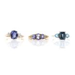 Three gem set rings, including a synthetic blue sapphire and white sapphire three stone ring, size J
