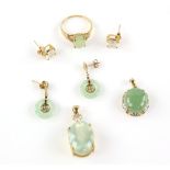 Two suites of jewellery, comprising an oval cabochon jade pendant, with a gold and diamond surround,