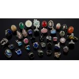 Forty dress rings mainly set in silver, one set with an oval cut sapphire, ring size P 1/2,