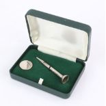 Modern silver golf marker and pencil in the form of a tee, in fitted case