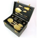 Parcel-gilt silver-plated travel dressing table set, comprising dressing table bottles, brushes,