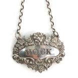 Victorian silver decanter label, for 'HOCK' with lion mask and grape vine border, with indistinct