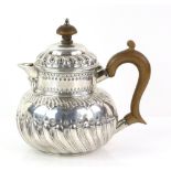 George III silver teapot with embossed and gadrooned decoration, maker's mark 'IB', London, 1802,