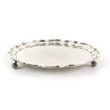 Modern silver salver with pie crust border on three scroll feet, by E P & Co., Sheffield, 1966, 17.