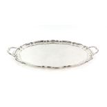 George V silver two handled tray, by Cooper Brothers & Sons Ltd, Sheffield 1930, with shaped border,