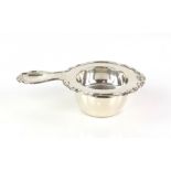 German silver tea strainer and bowl, by Wilhelm Theodor Binder, stamped 835, with shaped