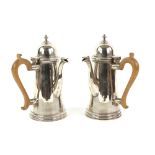 George V pair of silver chocolate pots, each with plain tapering bodies and wooden handles, by C S