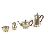 George V and later silver composite tea-service, by Spink & Son, London 1933, cream jug 1969, each