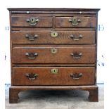 18th/19th century bachelor's oak chest with brushing slide above two short over three long graduated