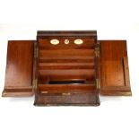 19th century rosewood letter rack, the hinged front opening to reveal four open section and fitted