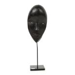 Fine classical shape Dan Tankagle dancing mask, Ivory Coast, good condition, some losses to the wood
