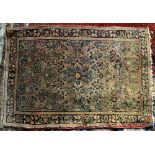 Persian style rug, with a central floral medallion with a floral design on a peach ground, within