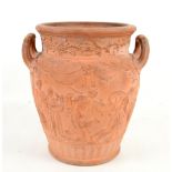 Wedgwood terracotta two handled urn moulded with Bacchanalian figures after the antique, the base