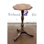 Early 19th century mahogany octagonal wine table on turned column support and tripod base, the top
