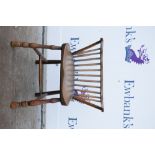 19th century child's elm seated chair, with bow arms on turned front supports, height of back 45.