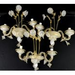 Three Murano glass two branch wall sconces, with flowering stems with gilt detailing, H42 x W45cm (