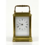 French brass repeating carriage clock, brass gorge case, white enamel dial with Roman numerals and