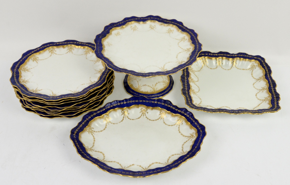 Late 19th/early 20th century dessert service with cobalt blue border, gilt bows and swags with a