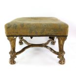 19th century carved giltwood foot stool with moulded frame and small scrolled feet united by X-