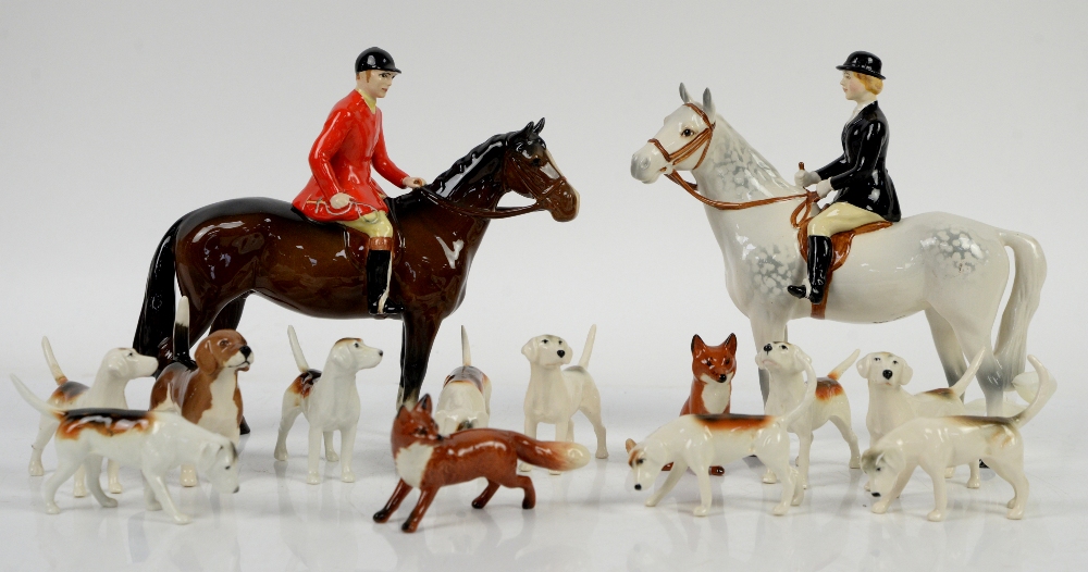 Beswick Huntsman and Huntswoman, 20cm, together with 9 foxhounds and two foxes