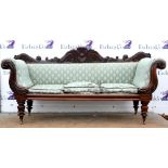 Late 19th century mahogany scroll arm sofa, the carved show frame with turned legs on castors.