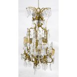 20th century gilt metal 20 light chandelier with glass drops, H100cm W.75cm