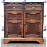 17th century style oak side cupboard with two short drawers above two geometric moulded panelled