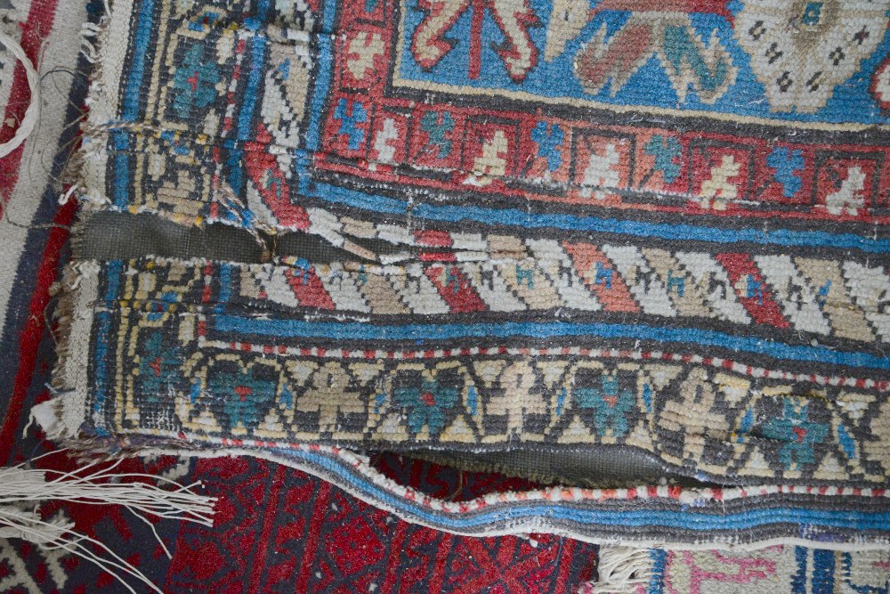 Tribal carpet with repeating Boteh motifs and three geometric medallions on a blue ground, within - Image 3 of 4