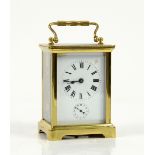 French brass carriage clock with alarm, white enamel dial with Roman numerals and subsidiary alarm