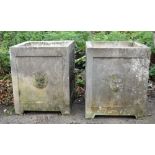 Pair of square composite stone garden planters with lion masks to sides, H58 x W48 x D48cm