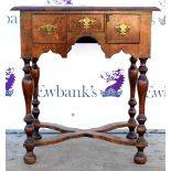 18th century walnut lowboy with herringbone crossbanded decoration and three drawers raised on