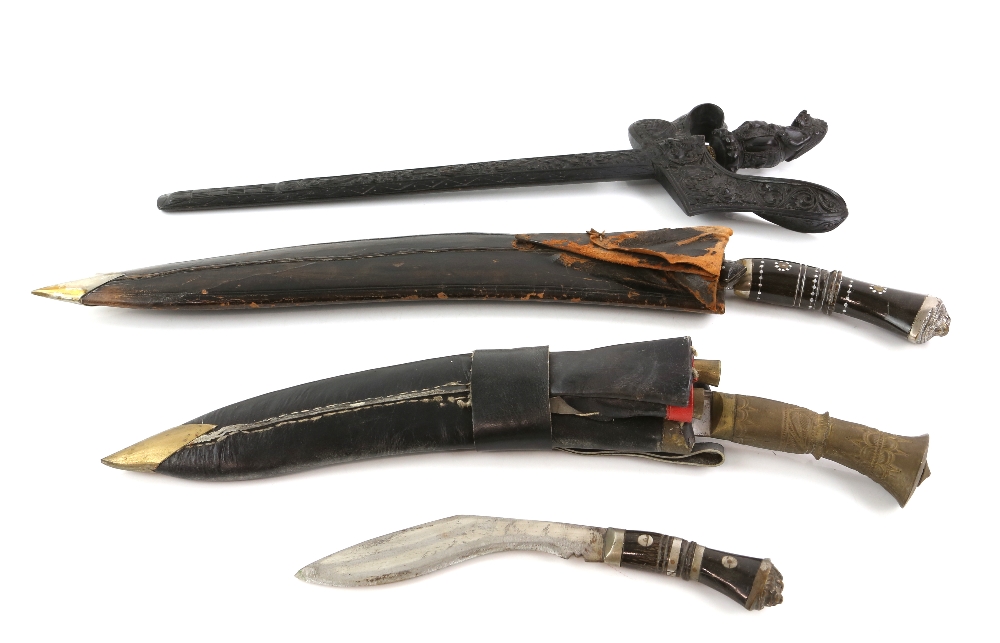 Two Indian Kukri a small Kukri and a modern Kris.