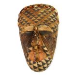 African tribal Kuba dance mask, with geometric pigmentation to face, mounted with beads and