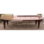 AMENDED DIMENSIONS Late 19th century mahogany oval extending dining table with four extra leaves,