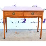 Early 20th century mahogany side table with two drawers on square tapering supports on castors. 100W