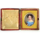 19th century portrait miniature on ivory of a young woman in a blue dress in fitted red leather