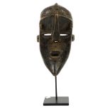 Lwalwa face mask, carved wood, Democratic Republic of Congo, mounted on bespoke stand. H35cm,