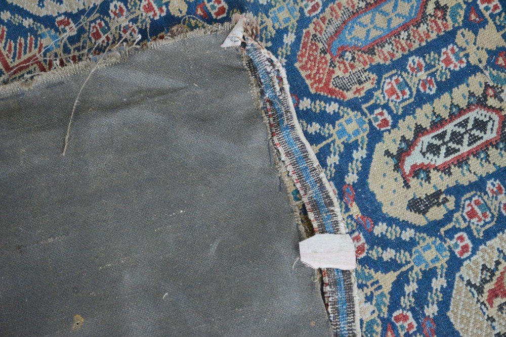 Tribal carpet with repeating Boteh motifs and three geometric medallions on a blue ground, within - Image 4 of 4