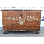 19th century stained pine coffer, the hinged top with painted decoration and wood effect, raised